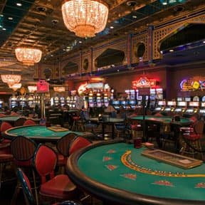 Live casino dealer at baccarat table streamed for Philippine online players